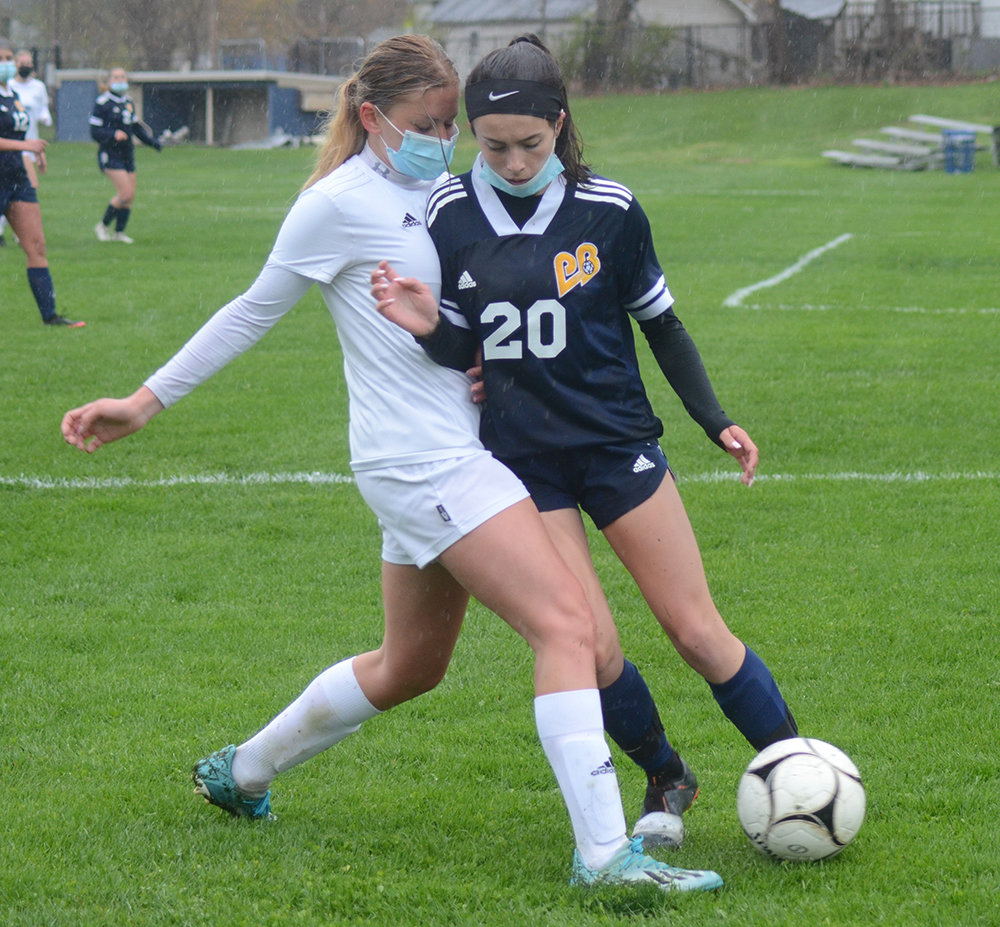 Pine Bush’s Morgan Tubbs and Marley Petersen battle for the ball during Friday’s OCIAA girls’ soccer game at EJ Russell Elementary School in Pine Bush.